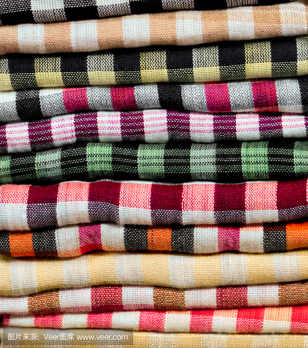 彩色的毛巾,尿布,折叠的纺织品,布作为背景